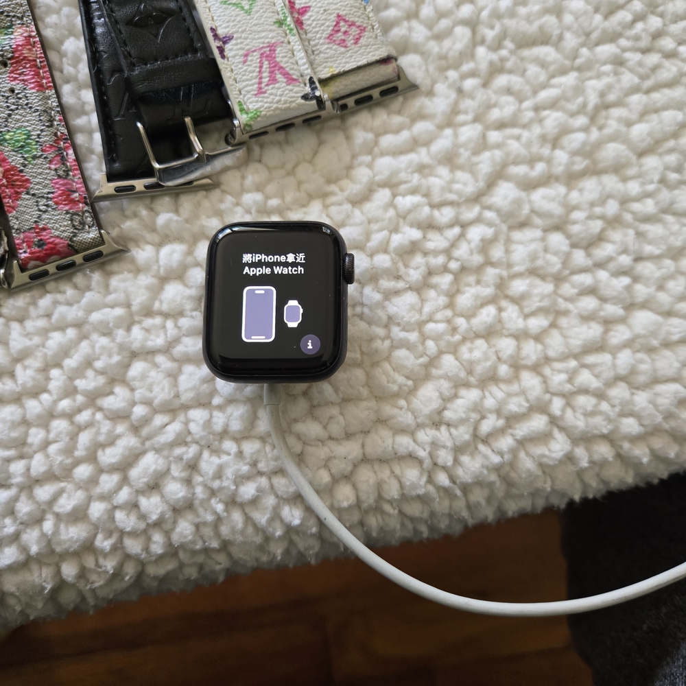 Black Apple Watch with Floral Bands